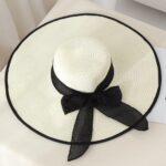 White Wide-Brim Straw Hat with Black Trim and Sheer Bow